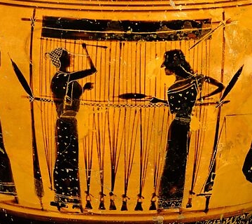 Women weaving at a warp-weighted loom on an ancient Greek vase.